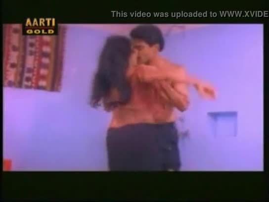 Indian aunty doing oil massage to her husband